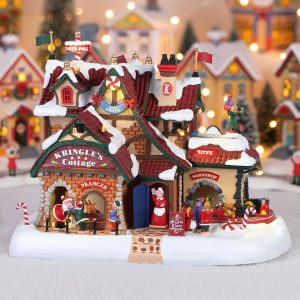 Casa di Babbo Natale Kringle's Cottage H 24 cm Edificio in Movimento Lemax - 95462