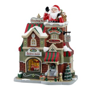 Negozio di Babbi Natale The Santa Shop H 23 cm Edificio Illuminato Lemax - 35039